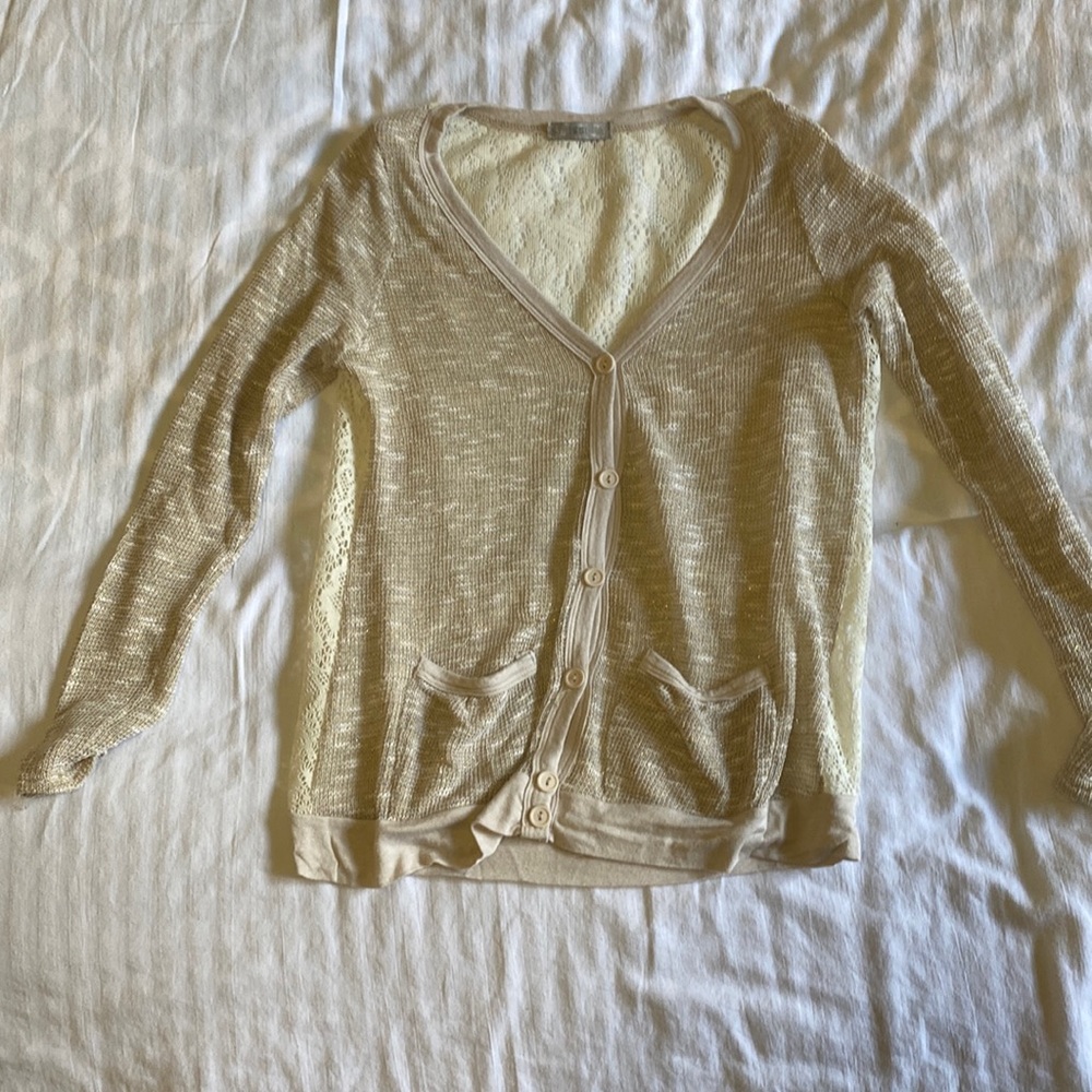 Never worn. Med cardigan with gold sparkle to it
